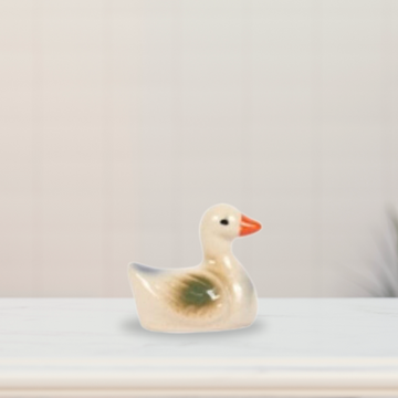 Miniature sitting duck for planters